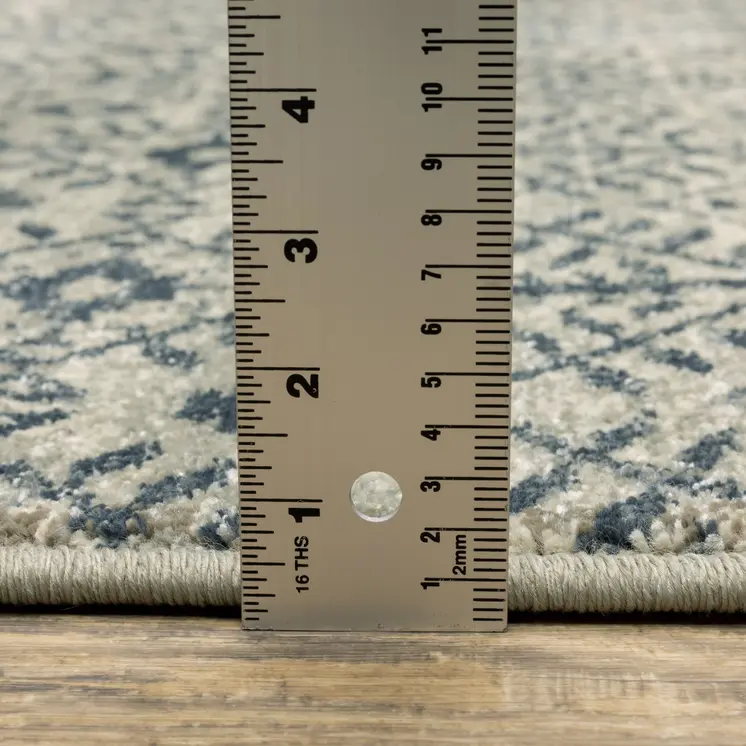 7' X 9' Blue And Beige Geometric Area Rug