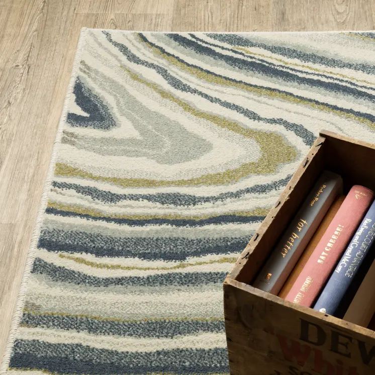 7' X 9' Ivory And Blue Abstract Area Rug