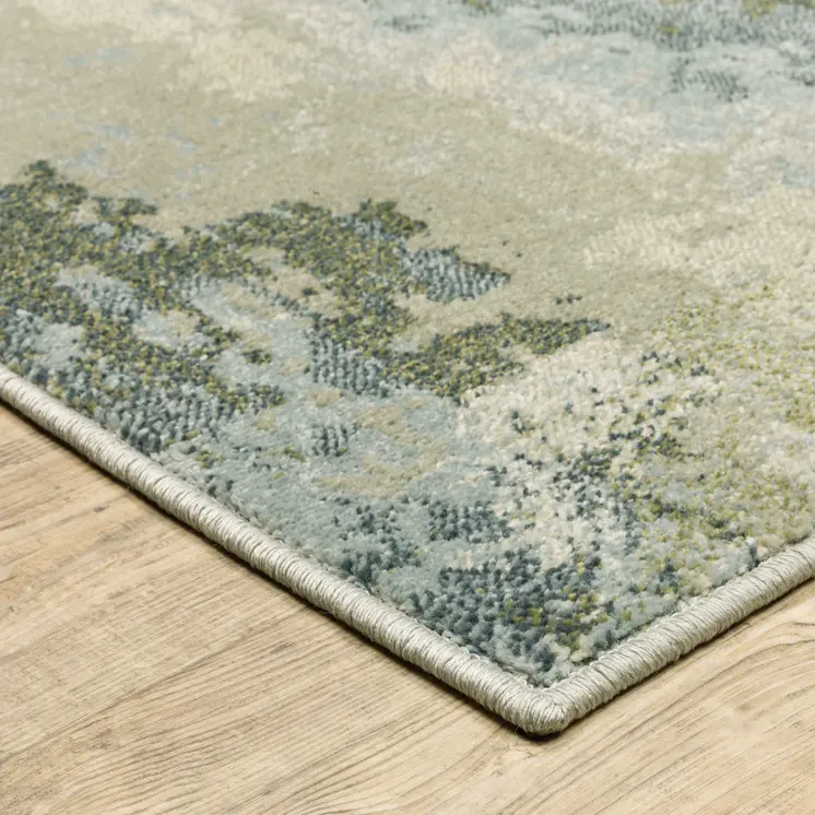 7' X 9' Green And Ivory Abstract Area Rug