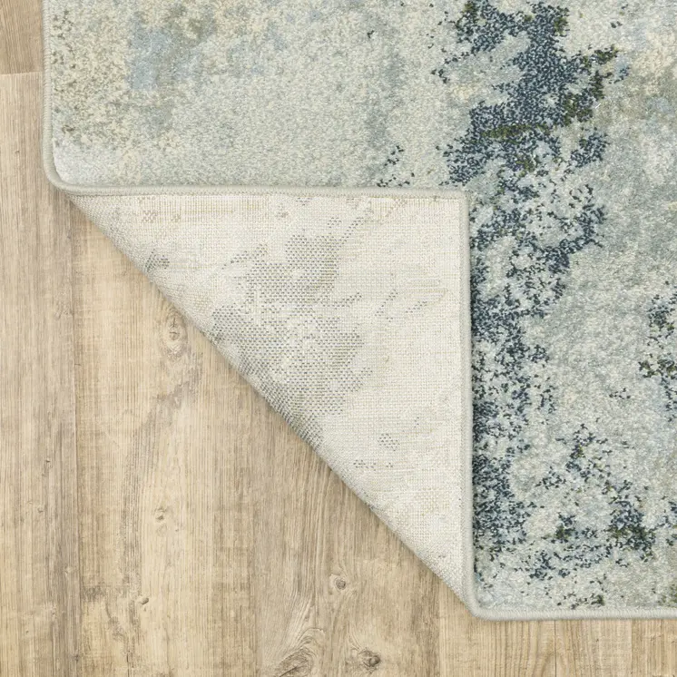 7' X 9' Green And Ivory Abstract Area Rug