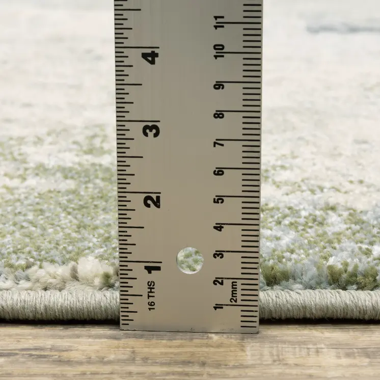 7' X 9' Green And Ivory Abstract Area Rug