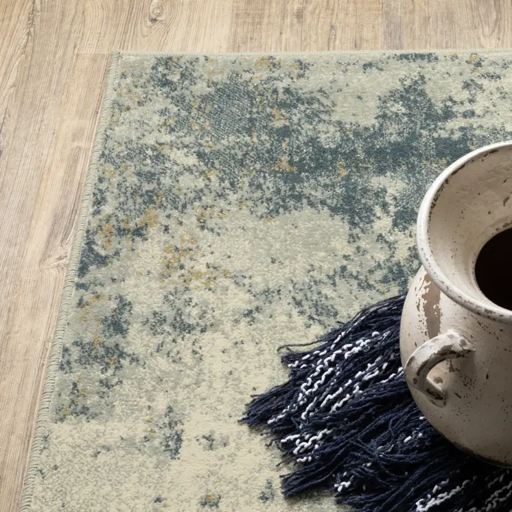 7' X 9' Beige And Ivory Abstract Area Rug