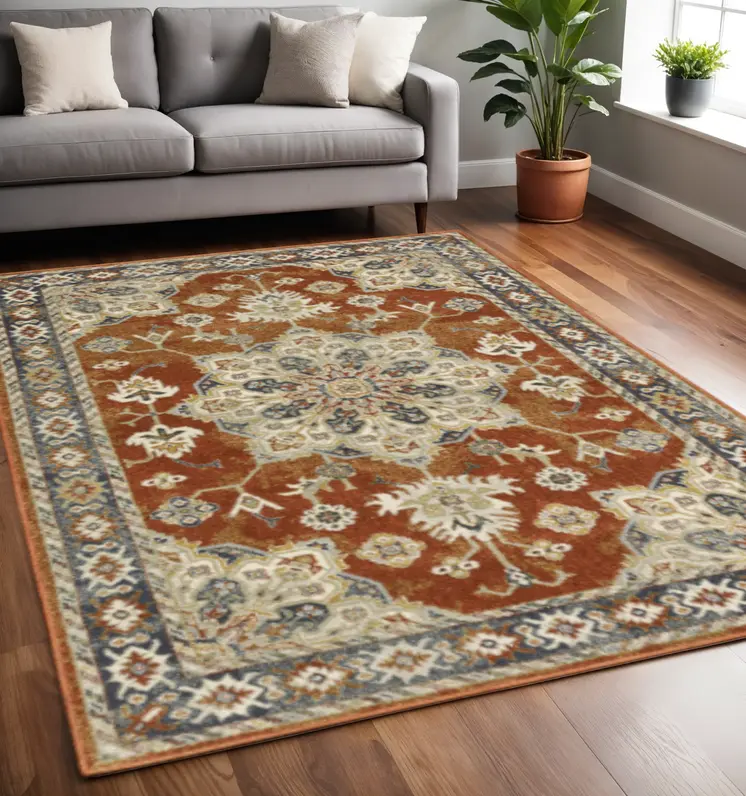 5' X 7' Rust Beige Teal Blue And Gold Oriental Power Loom Stain Resistant Area Rug