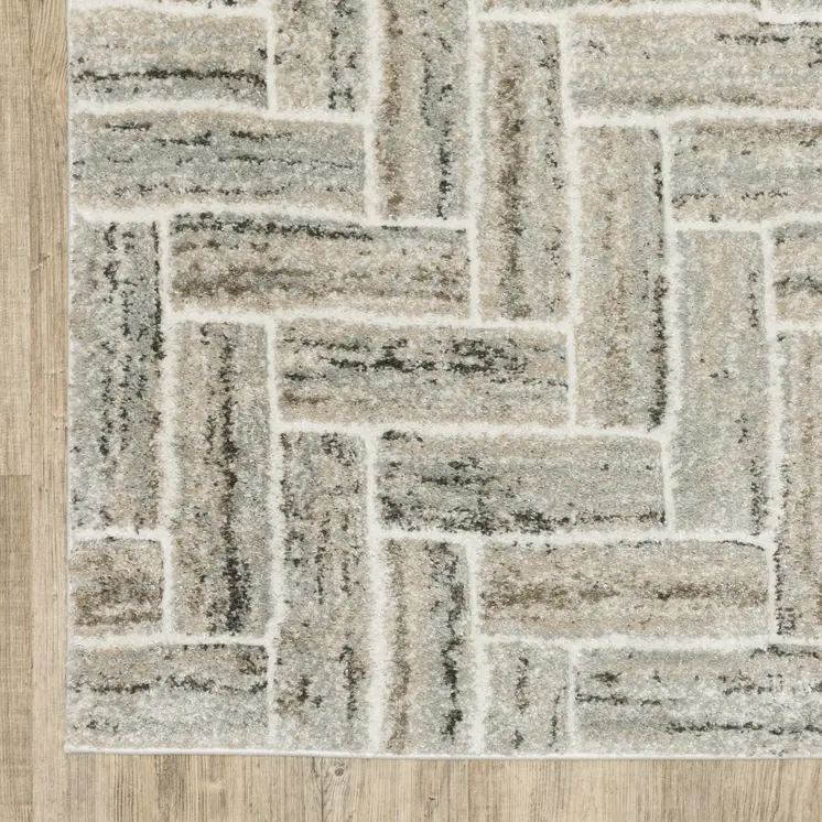 5' X 8' Ivory Beige Grey Brown Pale Blue And Charcoal Geometric Power Loom Stain Resistant Area Rug