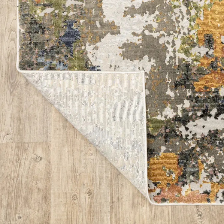 7' X 10' Beige Green And Orange Abstract Area Rug
