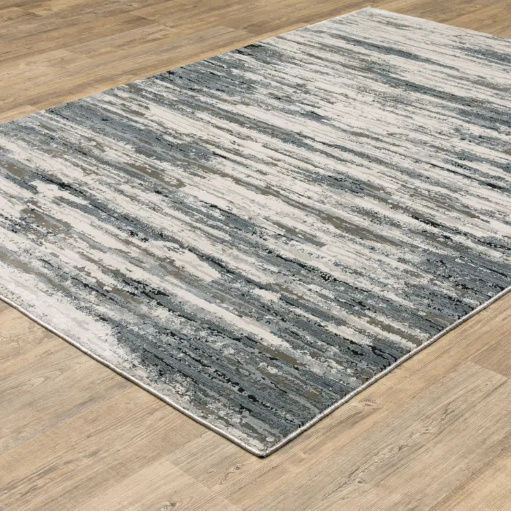 6' X 9' Blue Grey Beige And Brown Abstract Power Loom Stain Resistant Area Rug