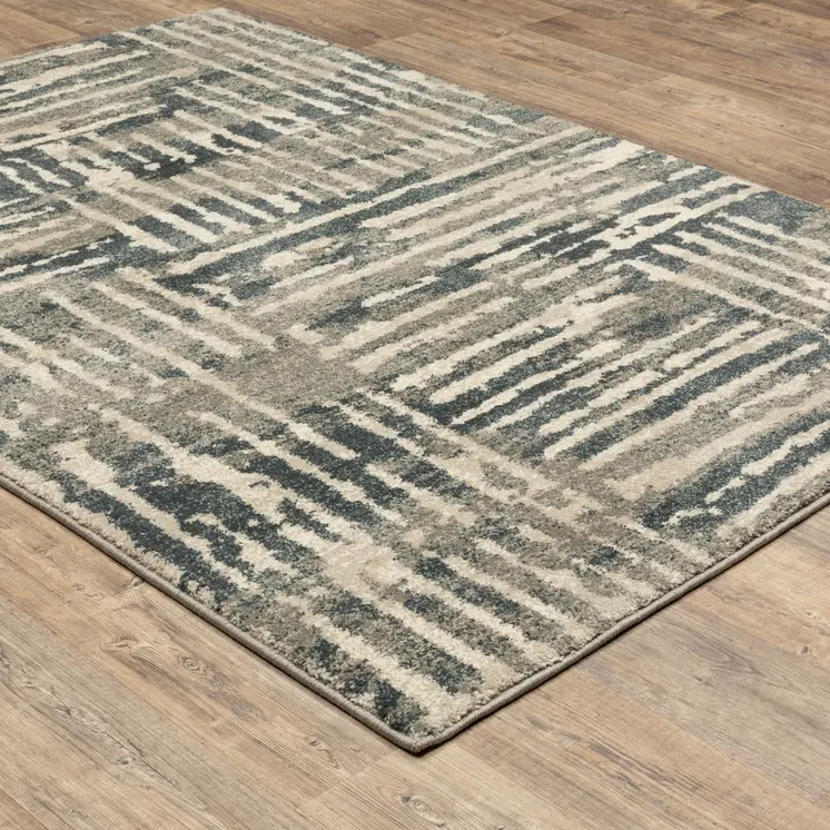 5' X 7' Blue And Beige Abstract Power Loom Stain Resistant Area Rug