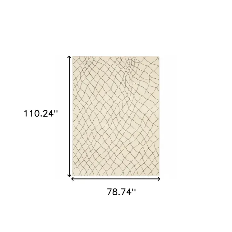 7' X 9' Gray And Ivory Geometric Shag Area Rug