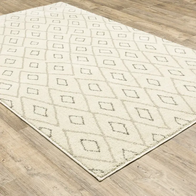 7' X 9' Gray And Ivory Geometric Shag Area Rug