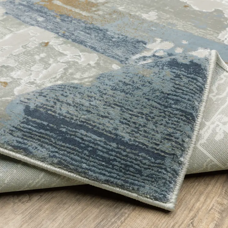 5' X 8' Grey Blue Navy Ivory And Brown Abstract Power Loom Stain Resistant Area Rug