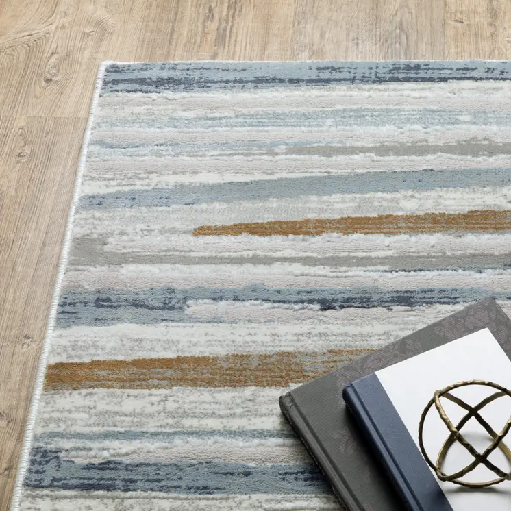 3' X 5' Grey Blue Ivory Brown Beige And Navy Abstract Power Loom Stain Resistant Area Rug