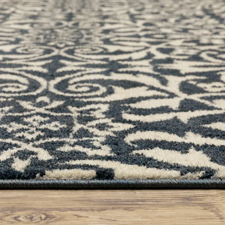 10' X 13' Blue And Ivory Floral Power Loom Stain Resistant Area Rug