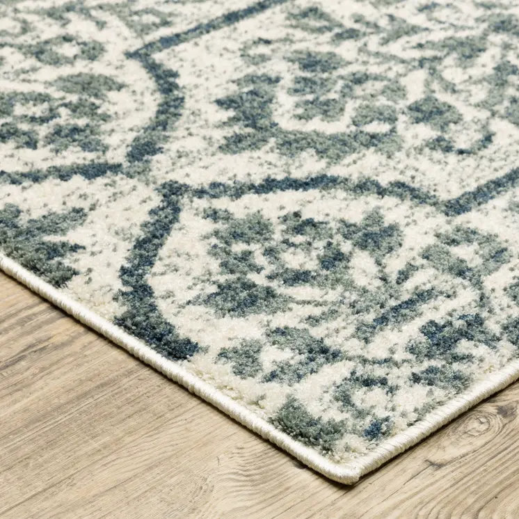 10' X 13' Ivory Blue And Sage Floral Power Loom Stain Resistant Area Rug