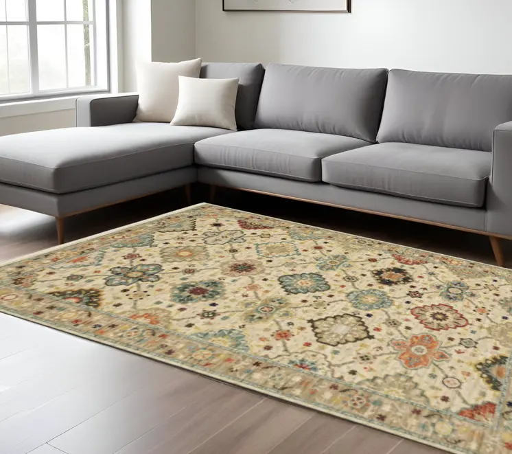 6' X 9' Beige Pale Blue Rust Gold Tan Brown And Orange Oriental Power Loom Stain Resistant Area Rug With Fringe