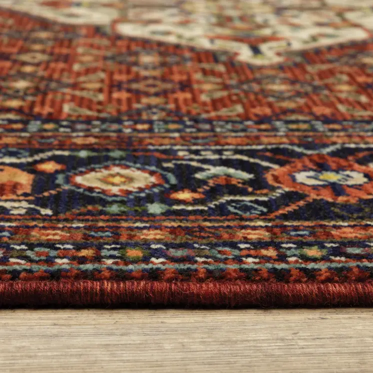 6' X 9' Red Blue Ivory And Orange Oriental Power Loom Stain Resistant Area Rug With Fringe