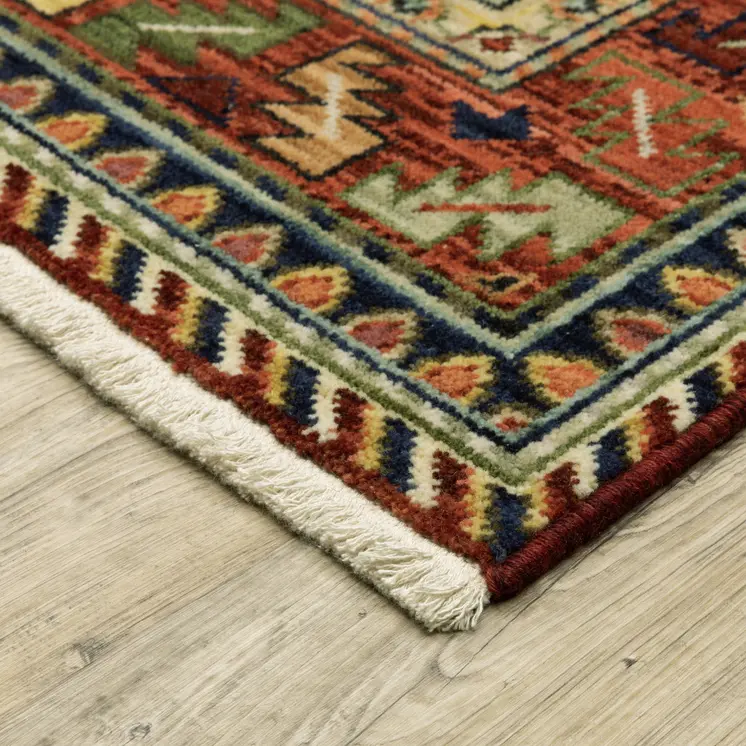 5' X 8' Red Blue And Beige Oriental Area Rug With Fringe
