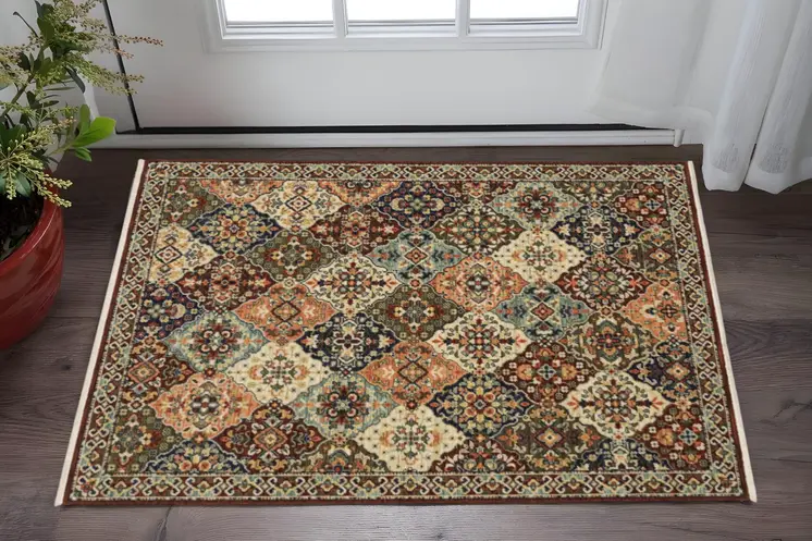 3' X 5' Red Rust Navy Light Blue Brown Orange Ivory And Gold Oriental Power Loom Stain Resistant Area Rug With Fringe