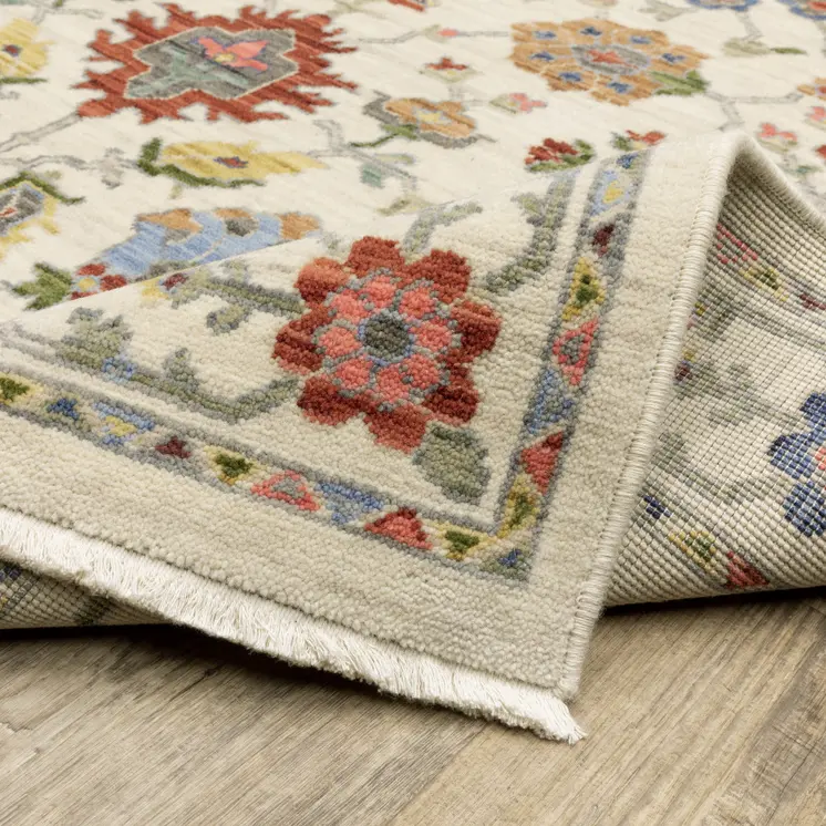 5' X 8' Ivory Blue And Red Oriental Area Rug With Fringe