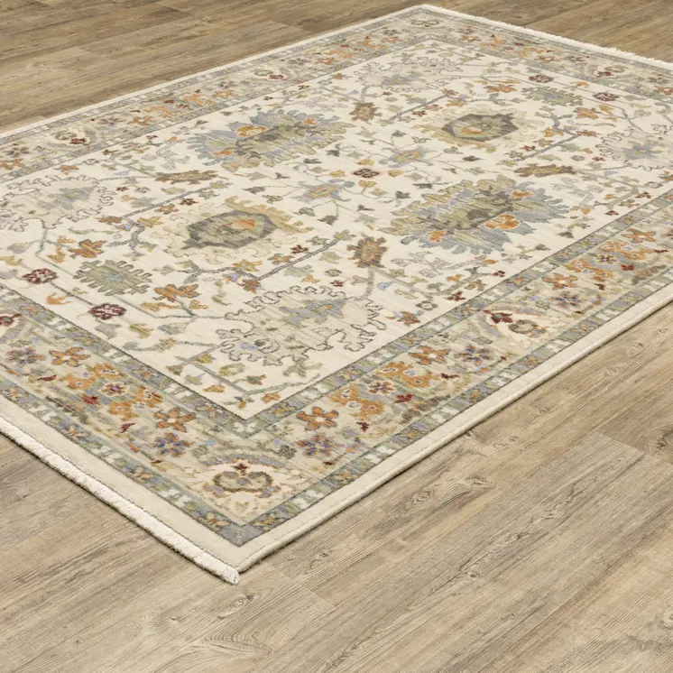 3' X 5' Ivory Grey Orange Green Blue And Red Oriental Power Loom Stain Resistant Area Rug With Fringe