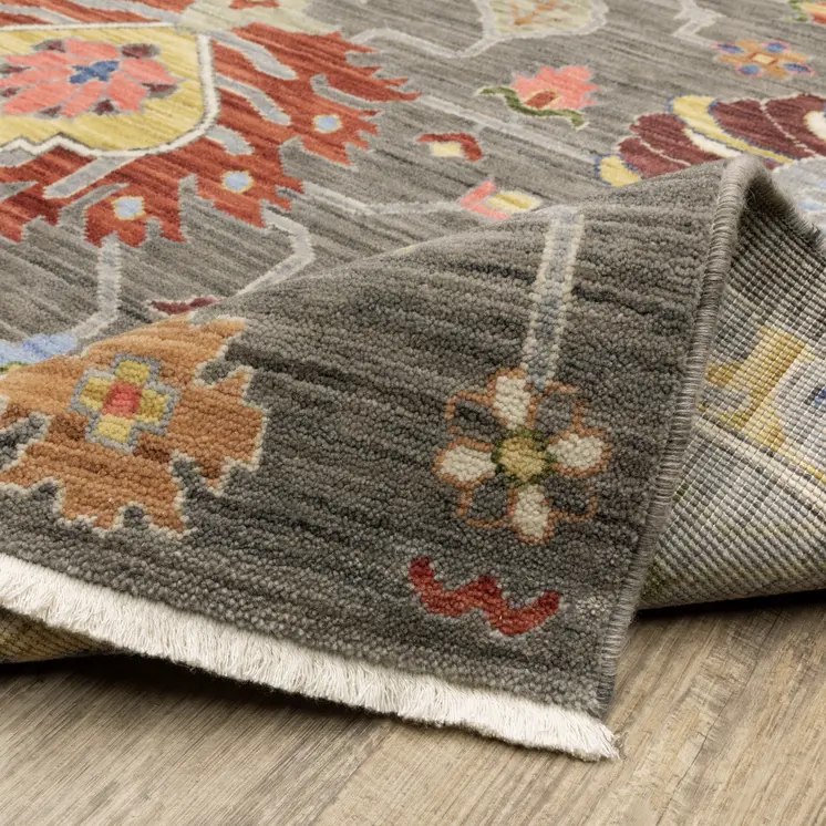 6' X 9' Grey Charcoal Yellow Blue Rust Red Pink Green And Ivory Oriental Power Loom Stain Resistant Area Rug With Fringe