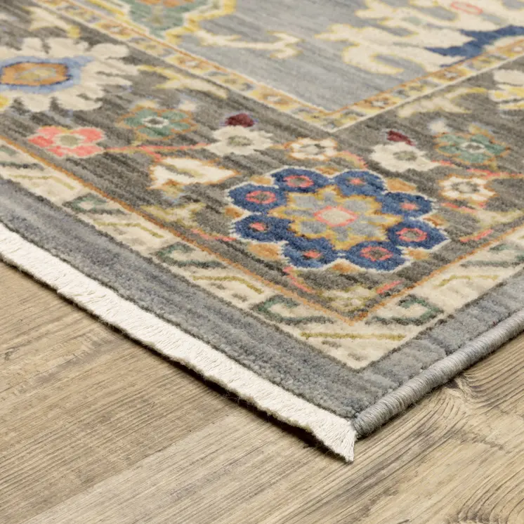 6' X 9' Blue Grey Gold Green Pink Orange Ivory And Red Oriental Power Loom Stain Resistant Area Rug With Fringe