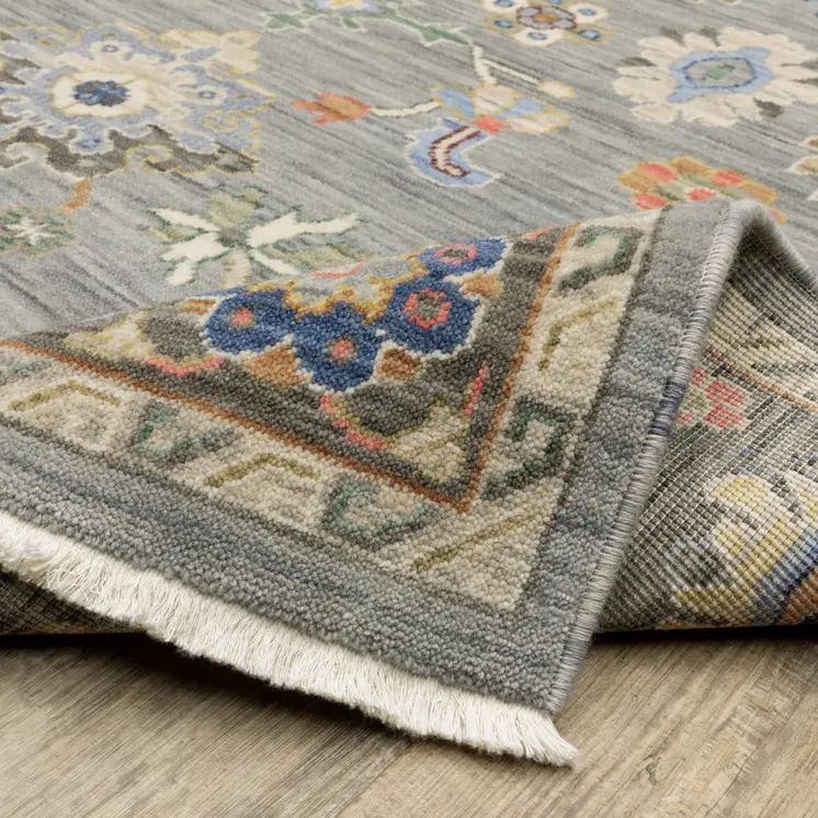 6' X 9' Blue Grey Gold Green Pink Orange Ivory And Red Oriental Power Loom Stain Resistant Area Rug With Fringe