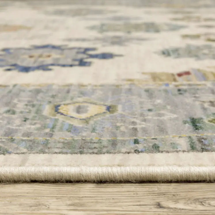 2' X 3' Ivory Blue Grey Teal Gold Green And Rust Oriental Power Loom Stain Resistant Area Rug With Fringe