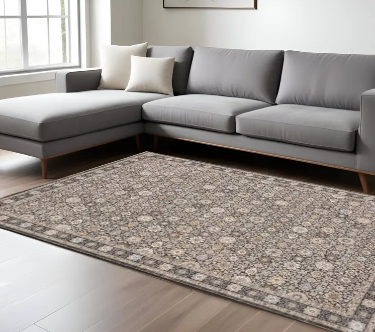 8' X 11' Charcoal Ivory and Beige Floral Power Loom Area Rug With Fringe
