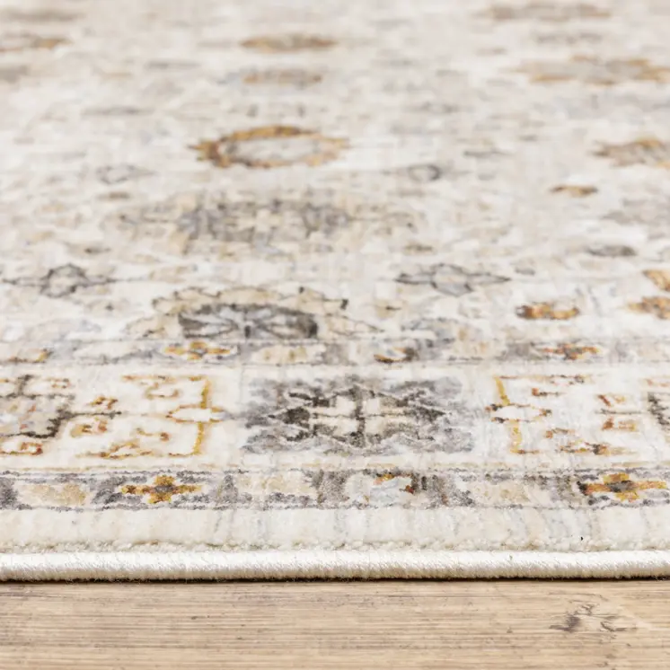 8' X 11' Ivory And Gold Oriental Power Loom Stain Resistant Area Rug With Fringe