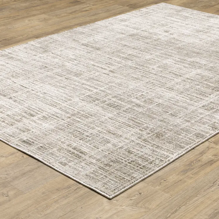 8' X 11' Beige Grey Ivory Tan And Brown Abstract Power Loom Stain Resistant Area Rug