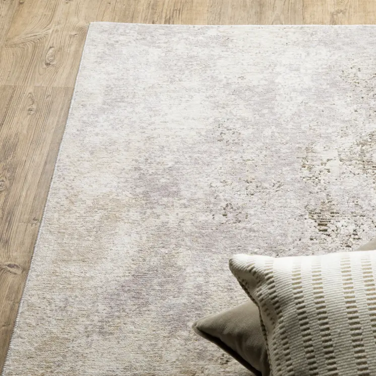 7' X 10' Ivory And Beige Abstract Distressed Area Rug