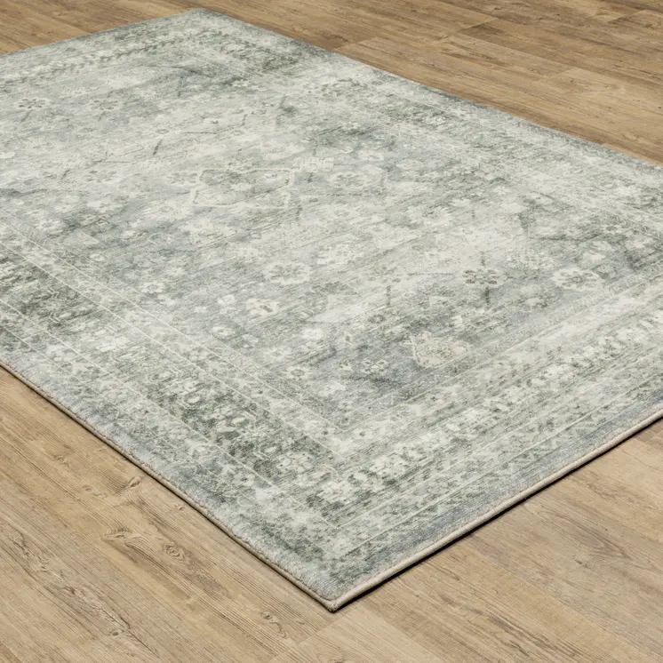 5' X 7' Blue Ivory And Grey Oriental Power Loom Stain Resistant Area Rug