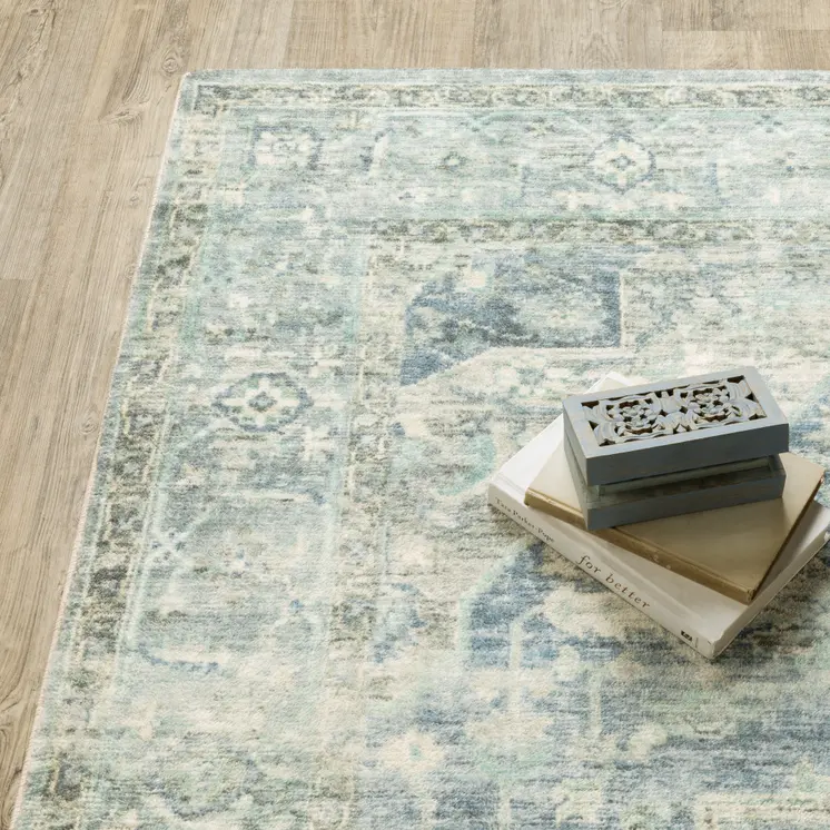 5' X 7' Grey Blue And Ivory Oriental Power Loom Stain Resistant Area Rug