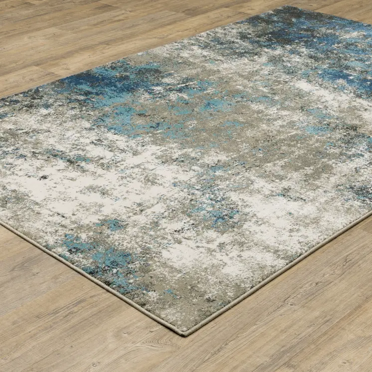 5' X 7' Blue Grey And Beige Abstract Power Loom Stain Resistant Area Rug