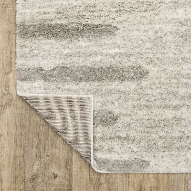 6' X 9' Ivory And Grey Geometric Shag Power Loom Stain Resistant Area Rug