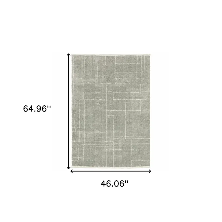 4' X 6' Grey And Ivory Geometric Shag Power Loom Stain Resistant Area Rug