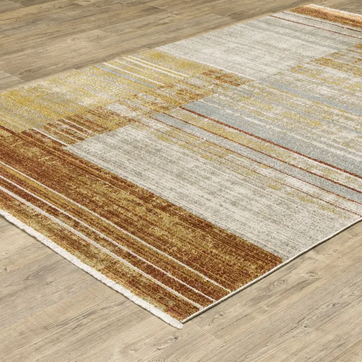 4' X 6' Rust Gold Blue Grey Ivory And Tan Geometric Power Loom Stain Resistant Area Rug With Fringe