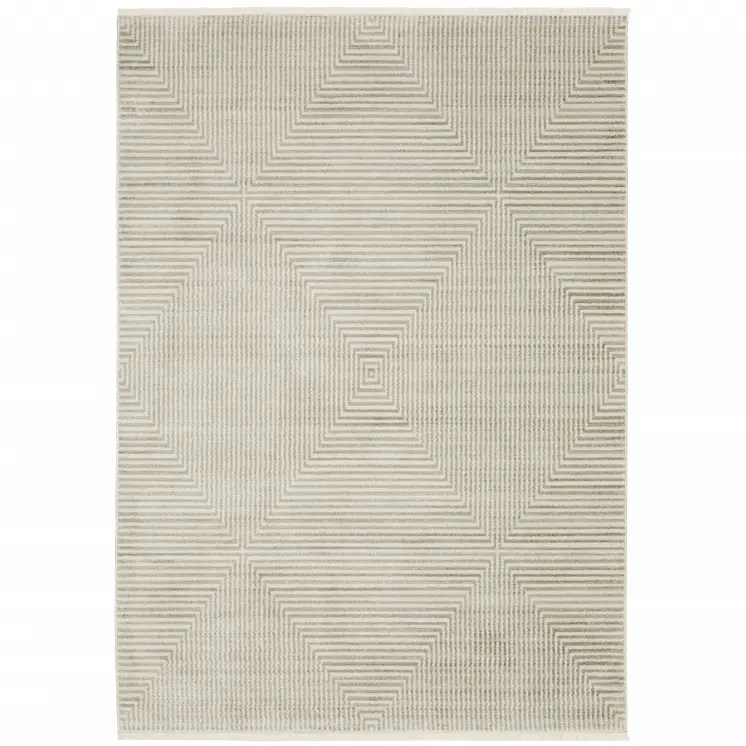5' X 8' Ivory Beige Taupe And Tan Geometric Power Loom Stain Resistant Area Rug With Fringe