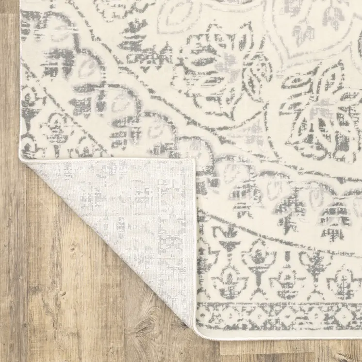 2' X 8' Ivory And Grey Floral Power Loom Stain Resistant Runner Rug