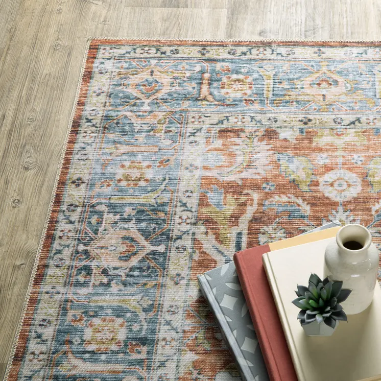 5' X 7' Rust Blue Ivory And Gold Oriental Printed Stain Resistant Non Skid Area Rug