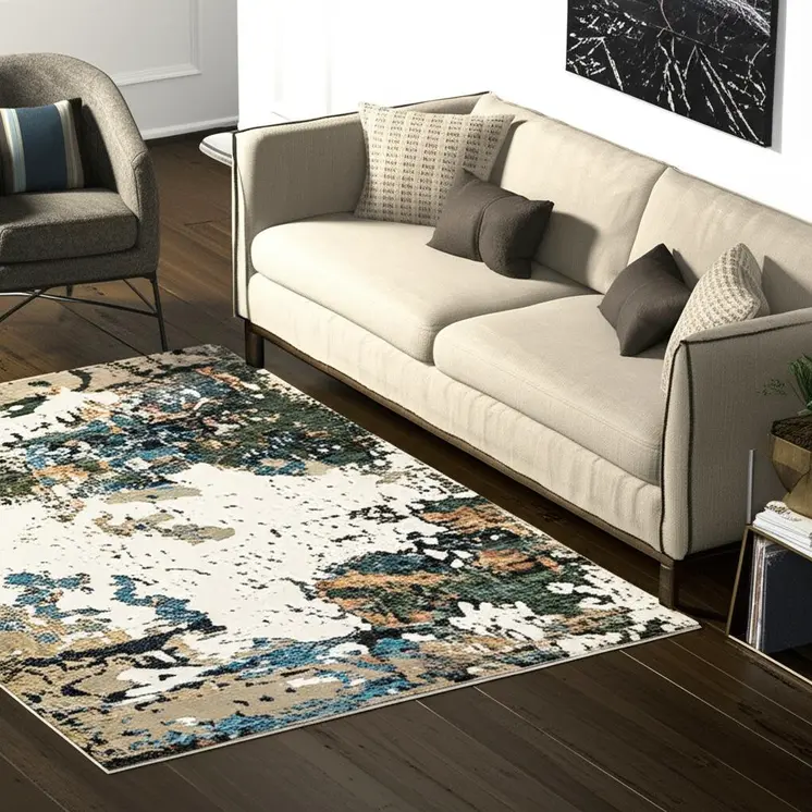 5' X 7' Blue and Ivory Abstract Power Loom Area Rug