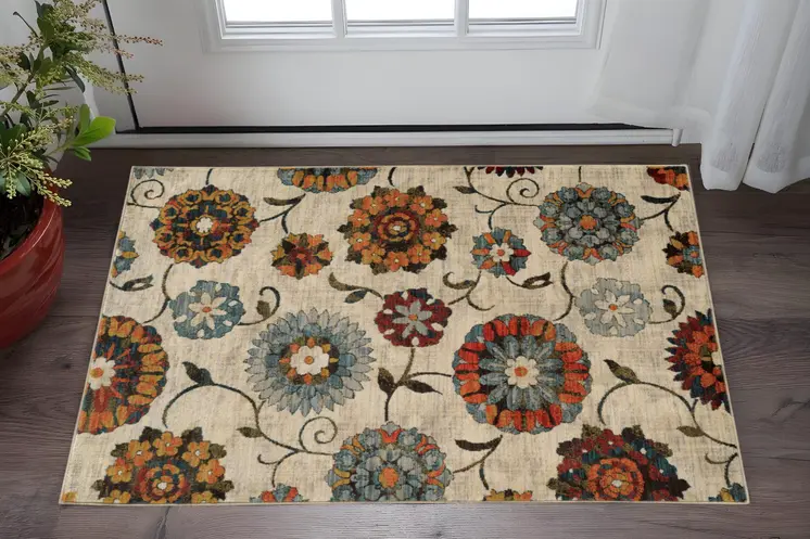 2' X 3' Ivory Blue Gold Green Orange Rust And Teal Floral Power Loom Stain Resistant Area Rug