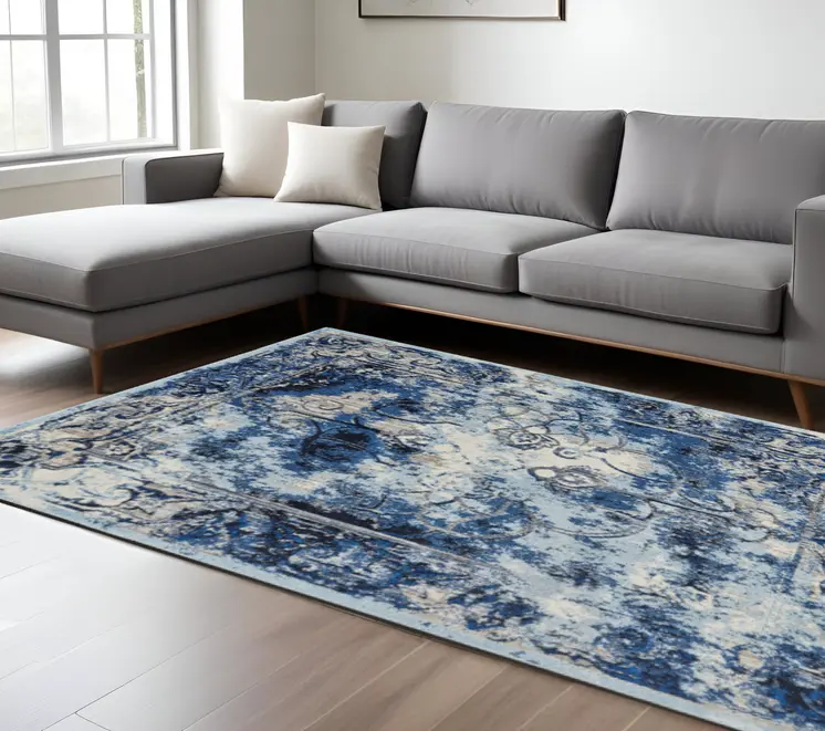 10' X 14' Blue Ivory And Gray Floral Distressed Stain Resistant Area Rug