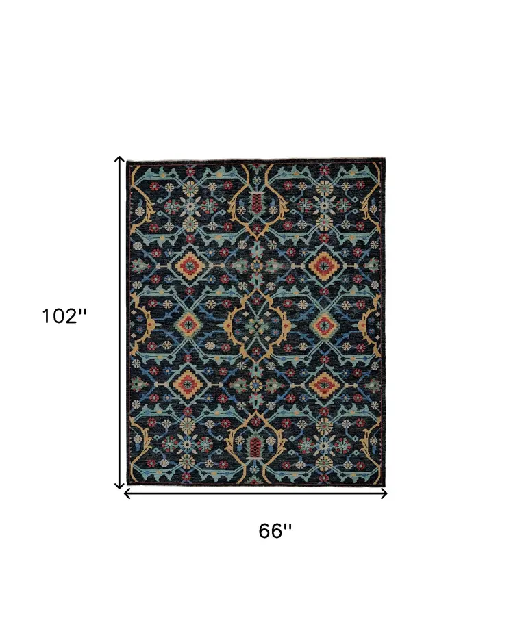 5' X 8' Blue Yellow And Red Wool Floral Hand Knotted Distressed Stain Resistant Area Rug With Fringe