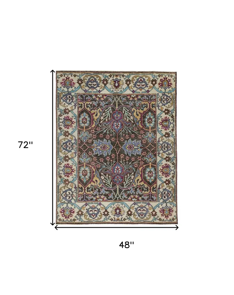 4' X 6' Ivory and Blue Wool Floral Hand Knotted Distressed Area Rug With Fringe