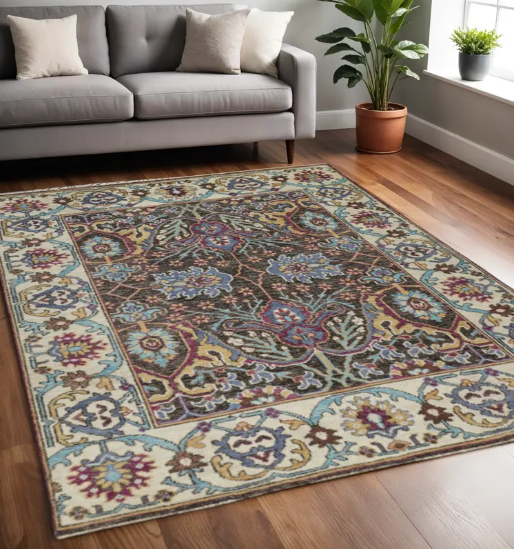 5' X 8' Ivory Brown And Blue Wool Floral Hand Knotted Distressed Stain Resistant Area Rug With Fringe