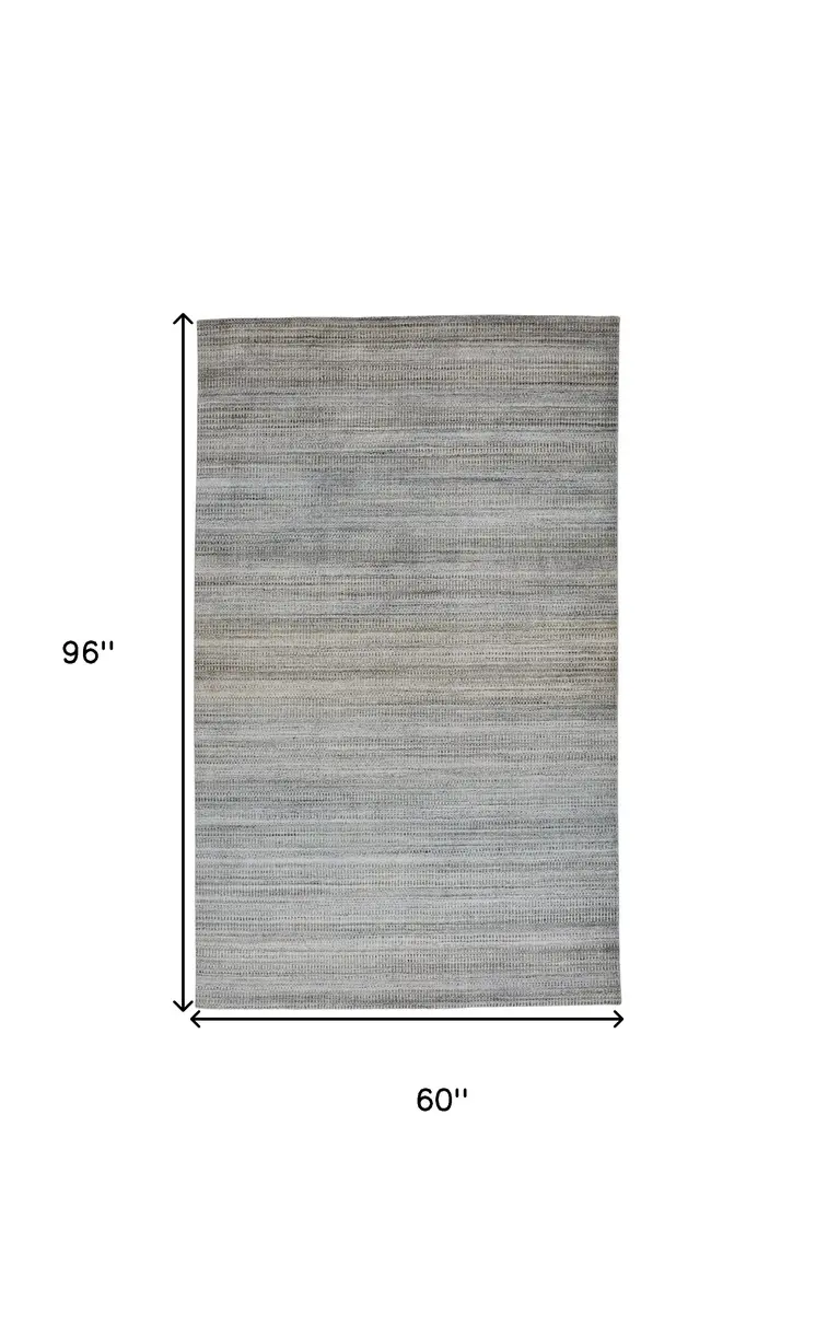 5' X 8' Blue Gray And Purple Ombre Hand Woven Area Rug