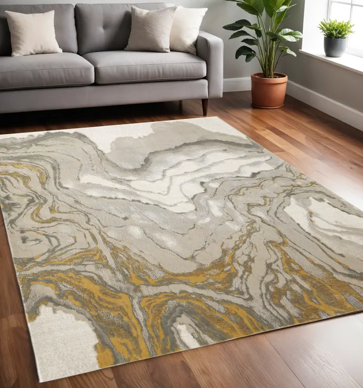 5' X 8' Gold Ivory And Gray Abstract Area Rug