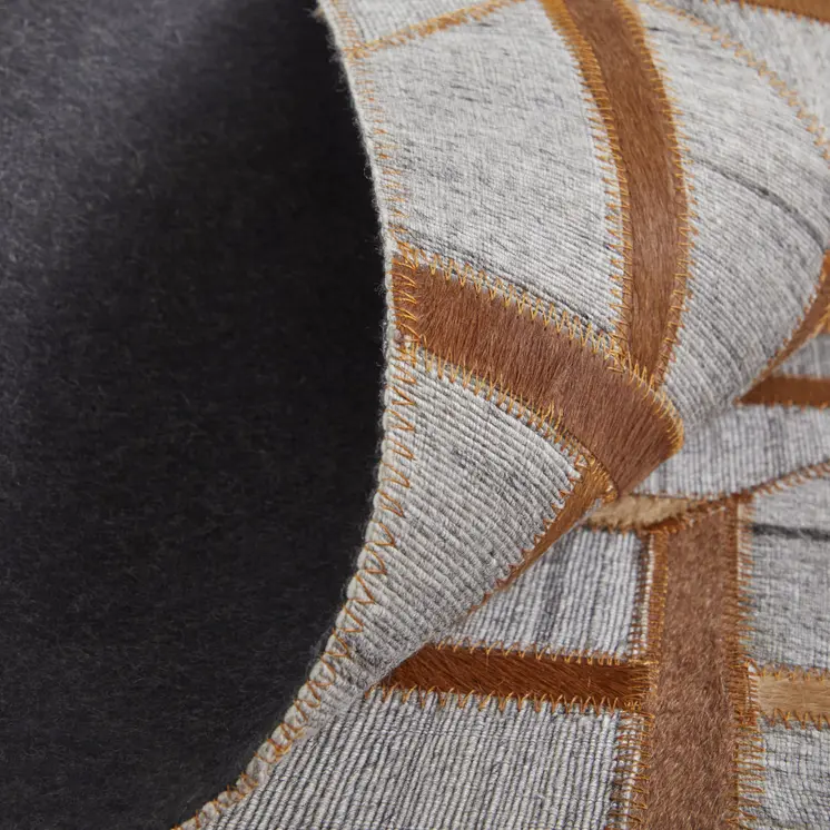 5' X 8' Tan and Brown Geometric Hand Woven Area Rug