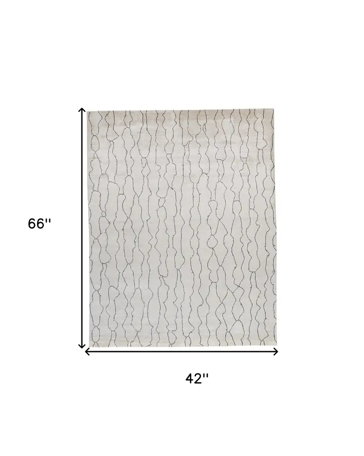 4' X 6' Gray and Ivory Abstract Hand Woven Area Rug